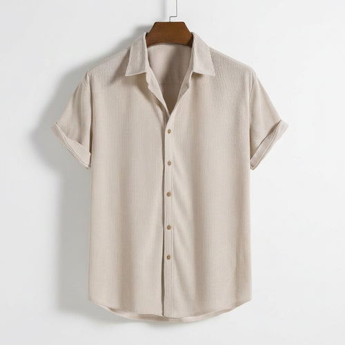 Beige striped shirt on a hanger against a white background