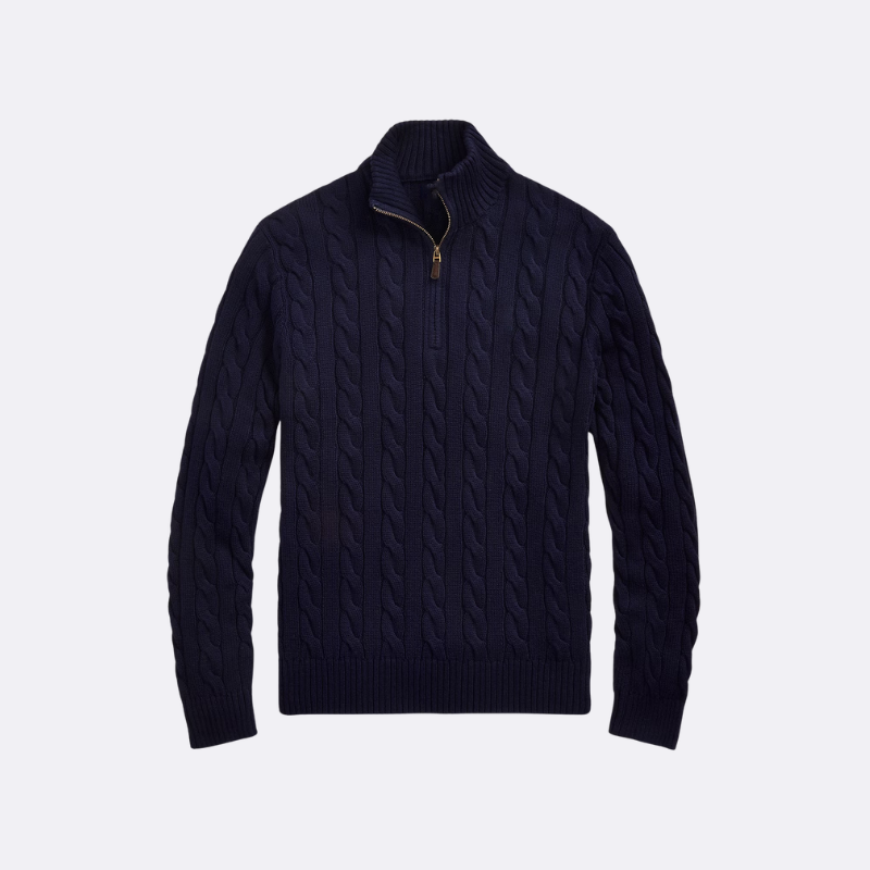 Navy blue cable knit sweater on a light gray background